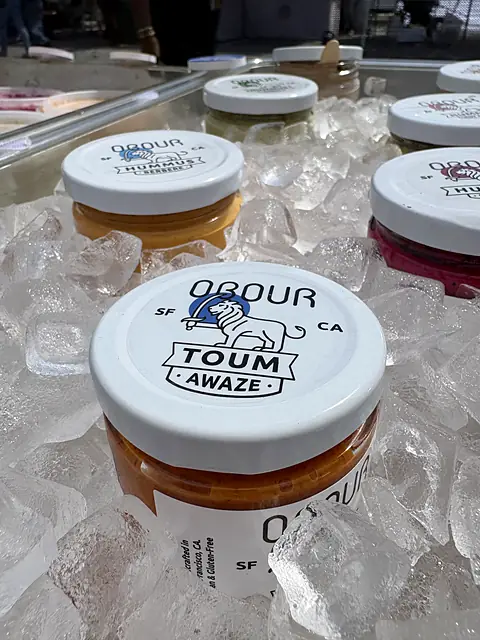 A jar of Obour Awaze toum on ice, seen from above