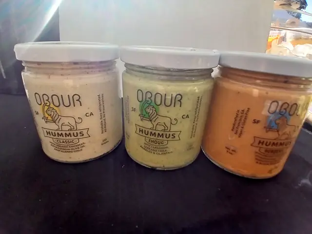 Jars of Obour Classic, Zhoug and Berbere hummus side by side