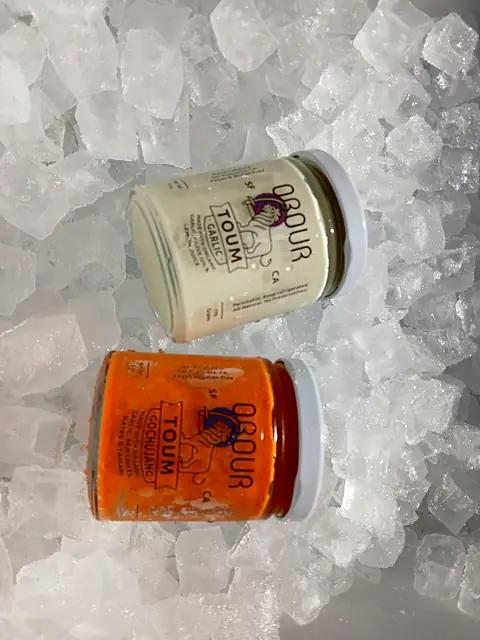 Jars of Obour Garlic and Gochujang toum on ice