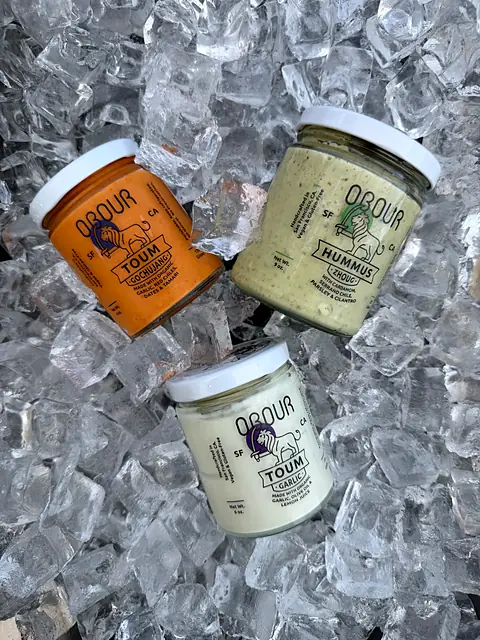 Jars of Obour Gochujang toum, Zhoug hummus and Garlic toum on ice