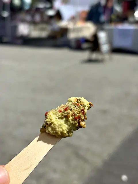 A tasting spoon of Hot Curry hummus