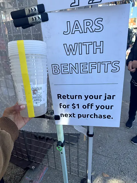 The Jars with Benefits sign: return your jar for $1 off your next purchase