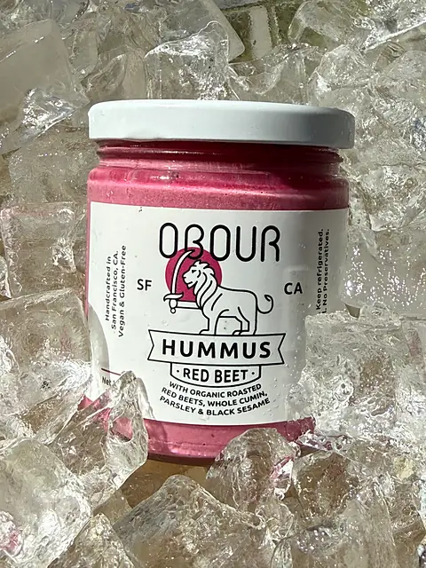 A jar of Obour Red Beet hummus on ice