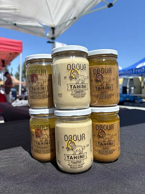 Jars of Obour Toasted, Date and Pomegranate tahini stacked two high