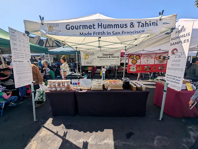 The Obour tent and table at a farmers market